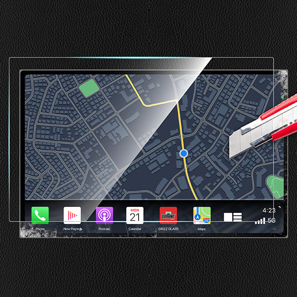 A GrizzProtector Displayschutzfolie for Nissan Juke 2 9" GPS resists scratches as a utility knife touches its edge.